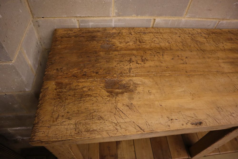 A Victorian beech and pine two tier kitchen table, width 183cm depth 65cm height 87cm